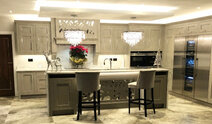 Renovated kitchen with island and pendant lights